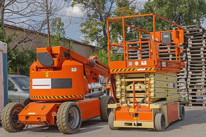 forklift transporting goods in a busy warehouse setting in Noble